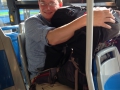 Holding all our bags safe on the bus ride to the airport :).