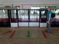There's rules for everything in Singapore. Here, Jac is demonsrating how to properly queue up for the subway.