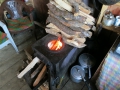 Cooking stove in a tea house. The pots and pans were put directly on top of the metal stove.